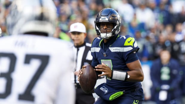 Nov 27, 2022; Seattle, Washington, USA; Seattle Seahawks quarterback Geno Smith (7) looks to pass against the Las Vegas Raiders during the first quarter at Lumen Field.